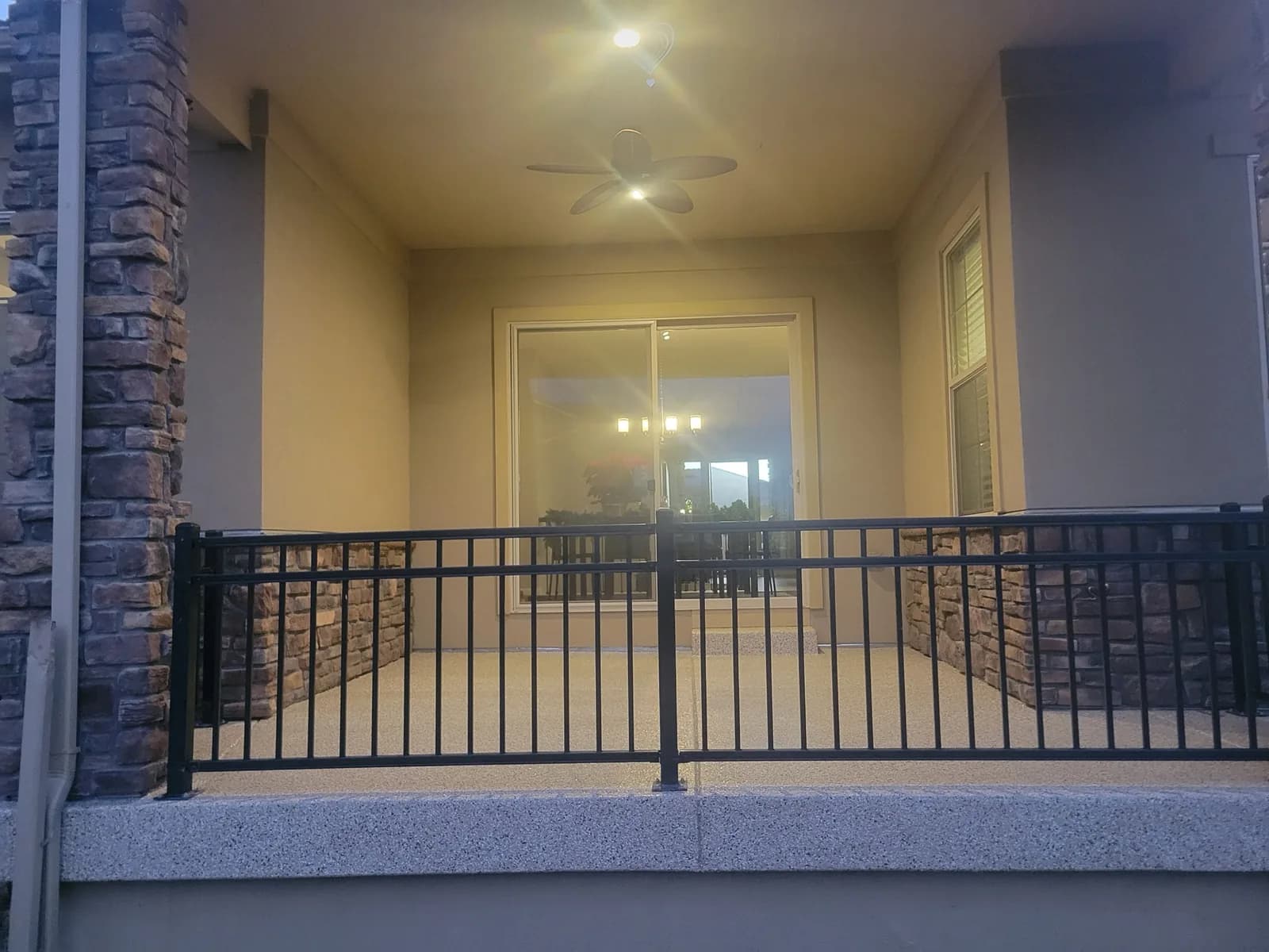 Coated covered porch floor at dusk