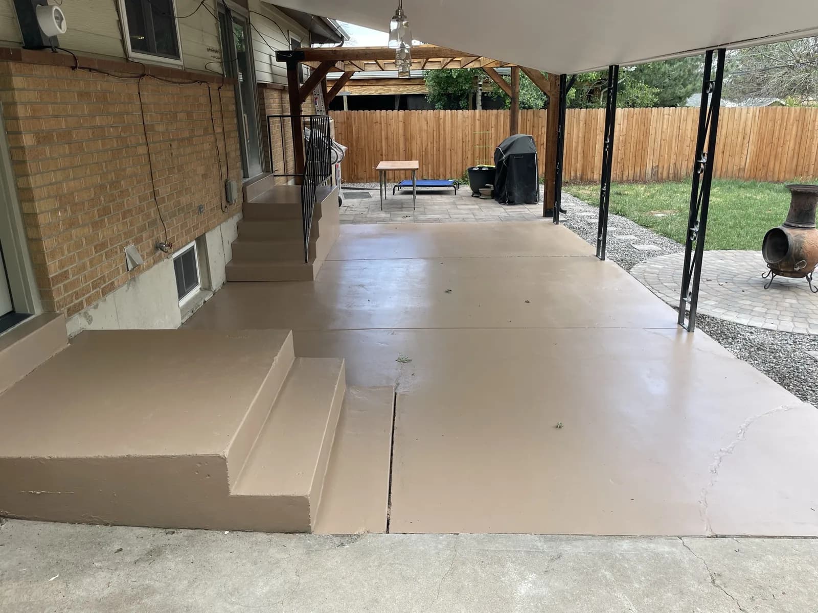 Covered patio with a fresh concrete coating in the Denver metro