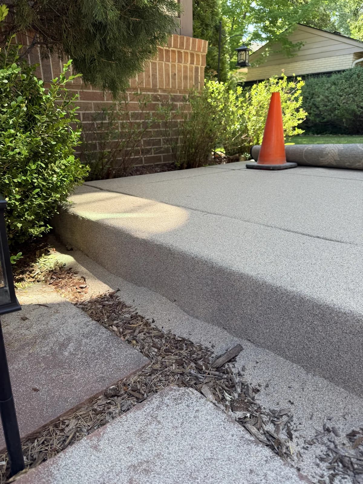 Decorative concrete walkway with a brick border