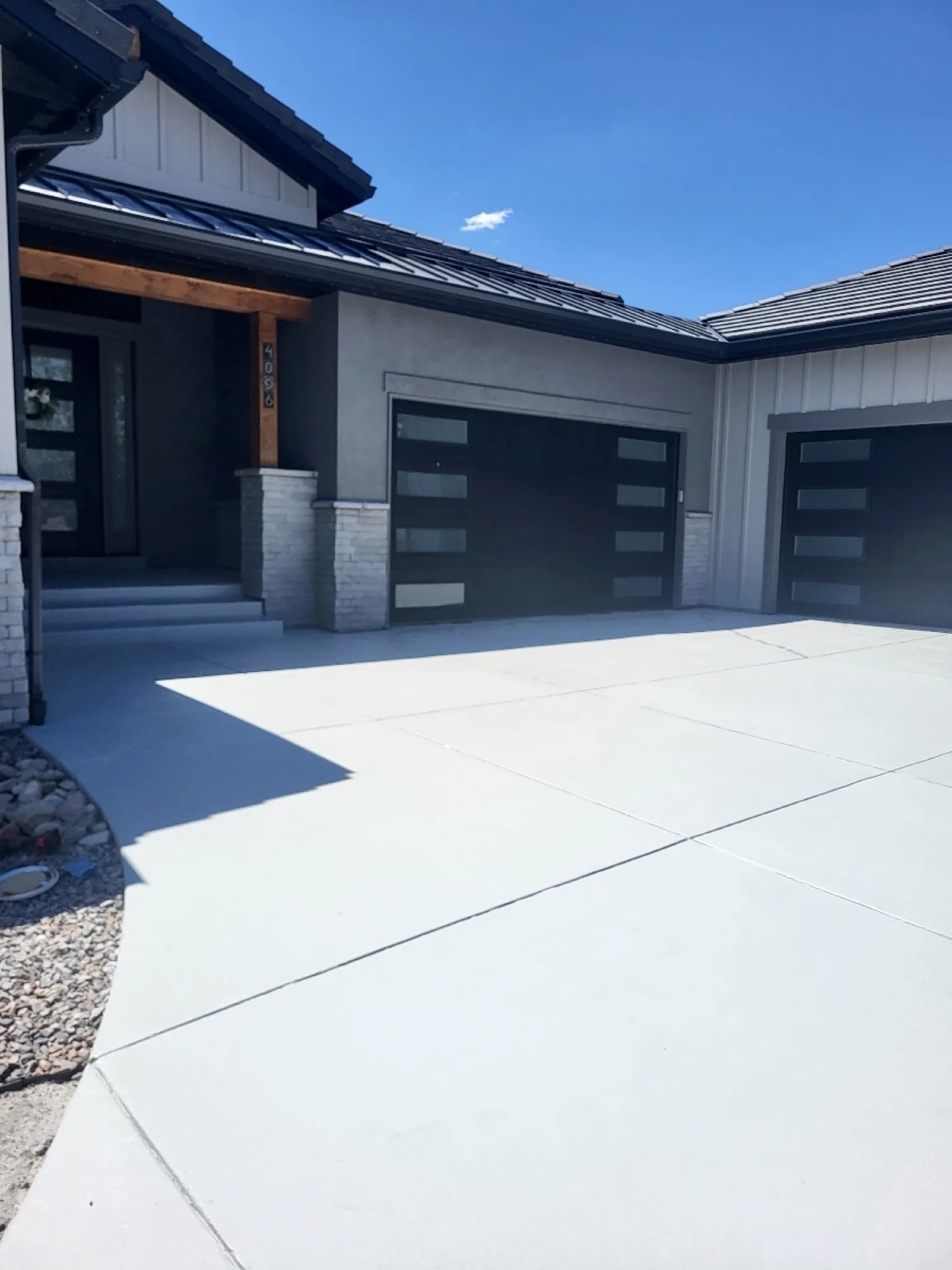 Resurfaced concrete driveway at a modern Denver metro home