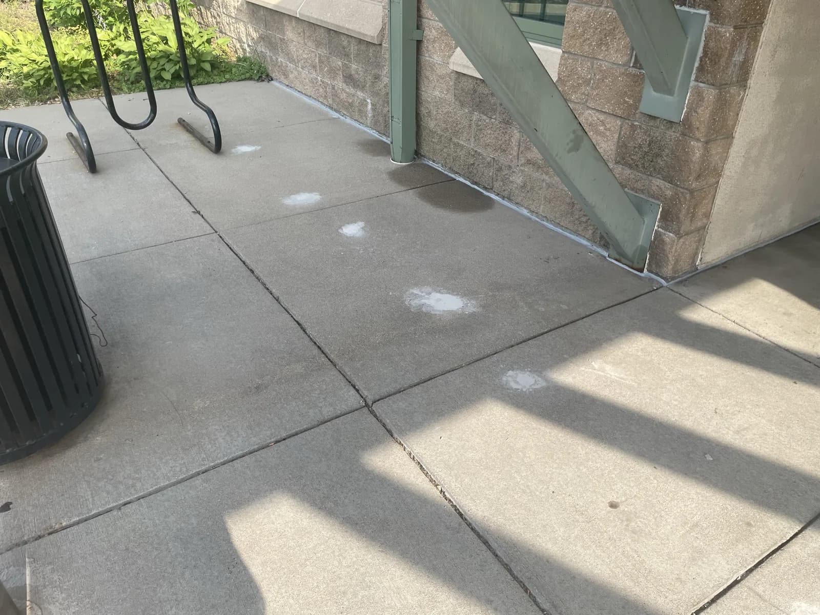 Completed concrete crack repair on a commercial sidewalk
